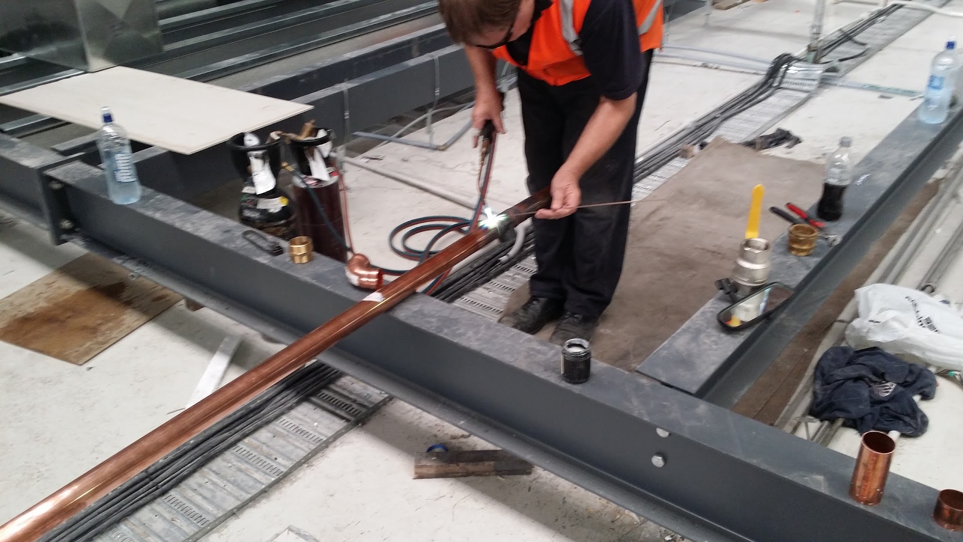 Commercial copper gas pipe installation on a construction site
