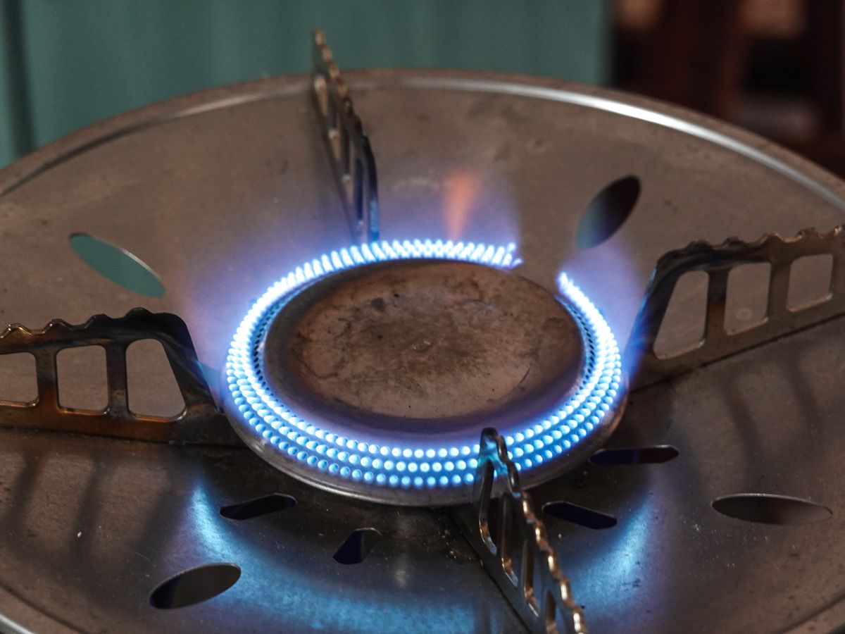 Blue gas flames burning evenly on a gas burner