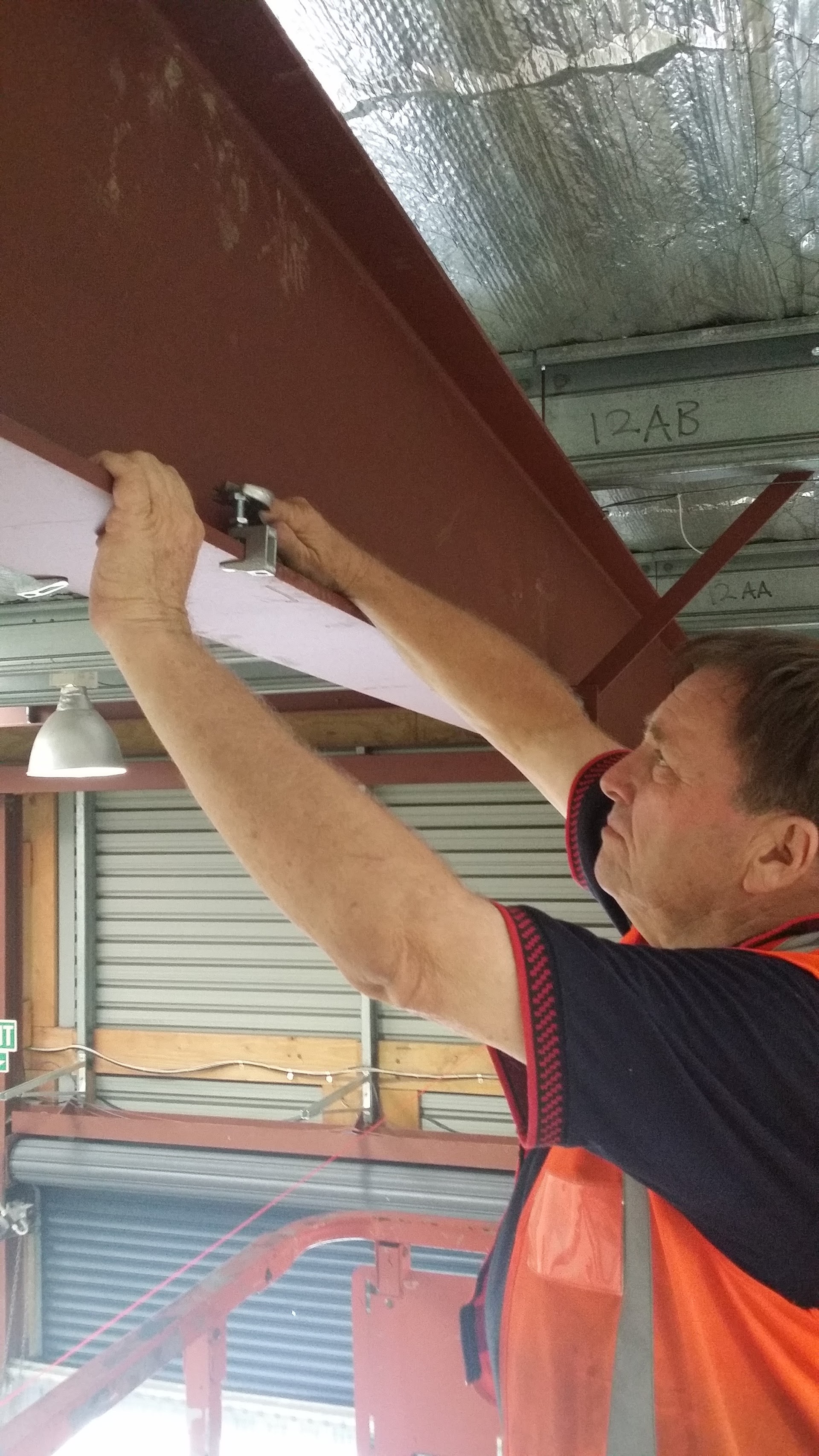 Team member checking plans on a commercial construction site