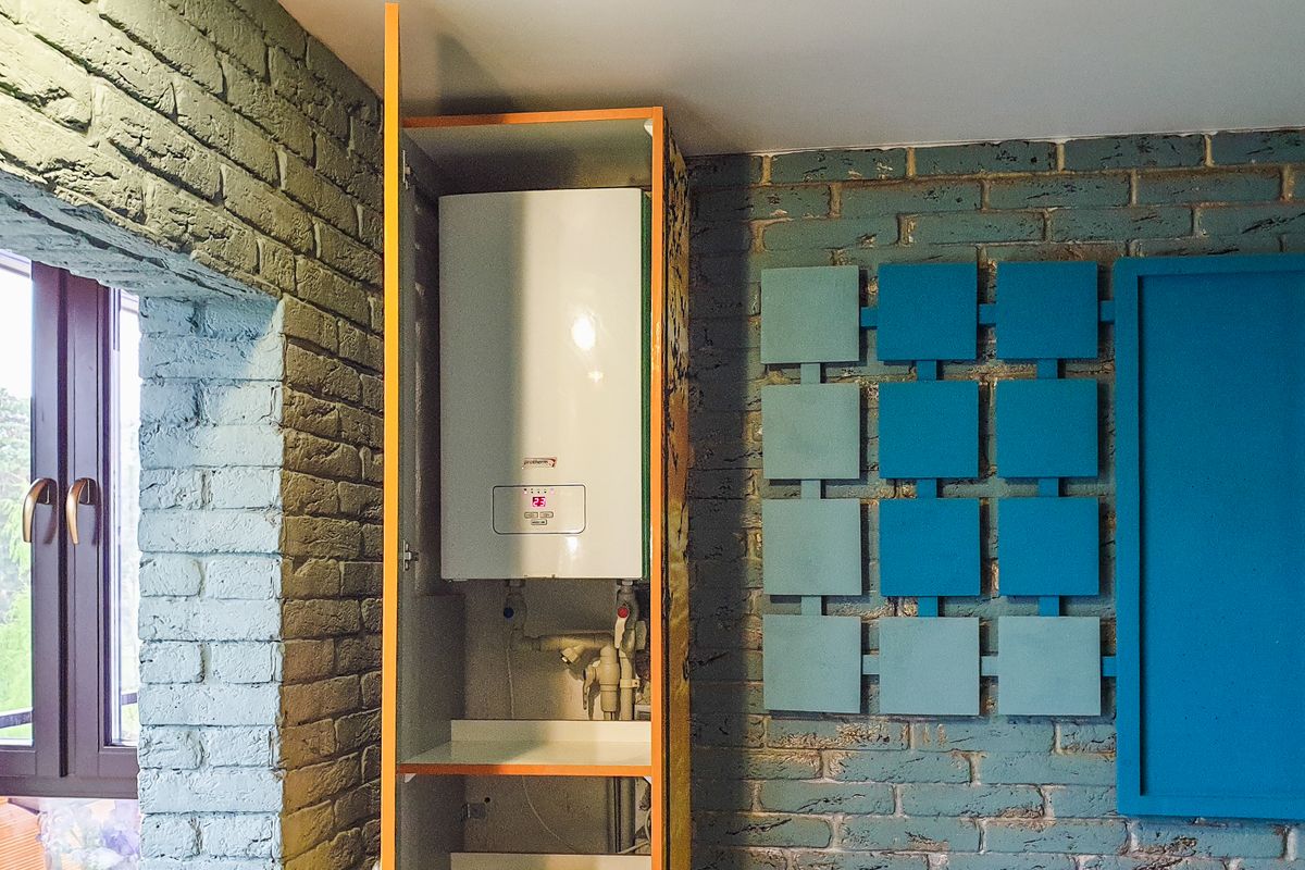Wall-mounted gas hot water unit installed in a home